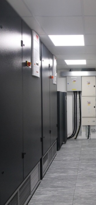 Modern data centre featuring wall mounted control panels, constructed by Infiniti IT